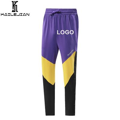 China Clash Colors Jogging Casual Men's Pants Split Button Pants Men's Pants Spliced ​​100% Polyester Breathable Pants for sale