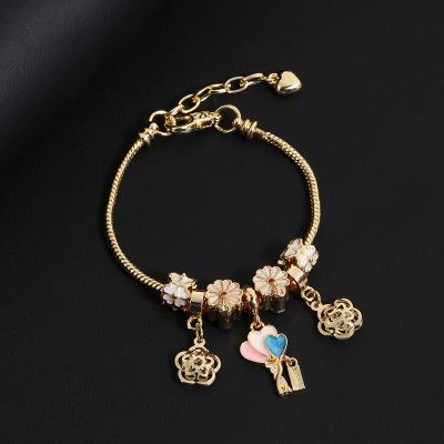 China Simple Lead Free Nickel Free Gold Plated White Bling CZ Crystal Flower Heart Charm Bracelet Drop Oil Flower Charm Bracelet For Women for sale