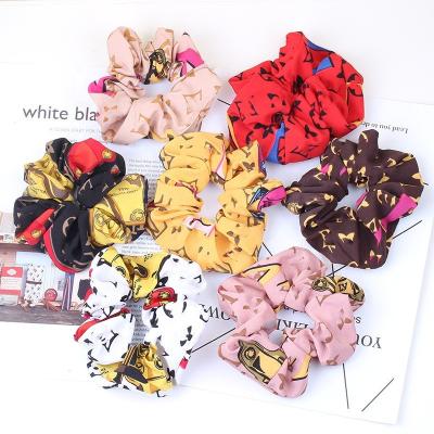 China Popular Fashion Classic Designer Scrunchies Fashion Elastic Hair Ties Hair Scrunchies For Women Ponytail Holder for sale