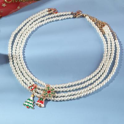 China INS Temperament Bead Christmas Necklace Alloy Drop Oil Snow Bells Religious Christmas Tree Necklace for sale