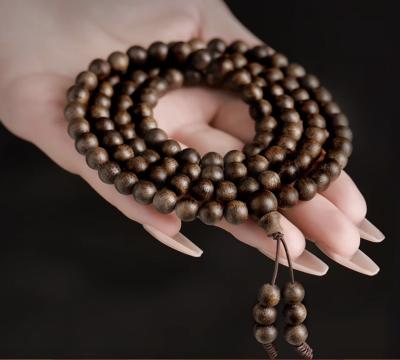 Cina Yazhuang Qinan Bracciale a perline di legno di agar Nove Punti Immersi in acqua Bracciali di legno di sandalo Perline di Buddha Per Uomini in vendita