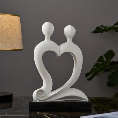 China Modern Abstract Resin Decorative Crafts Art Love Couple Sculpture Decoration for sale