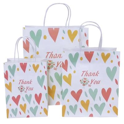 China Small Recyclable Wholesale Cool Printing Custom Kraft Paper Bag Handbag Gift Bag Shopping Bag for sale