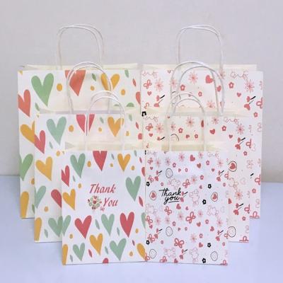 China Recyclable Customized Plain Cheap Kraft Paper Packaging Bags Holiday Decoration Gift Bags Carrying Paper Bags for sale