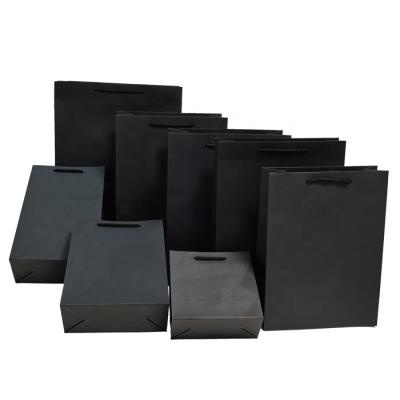 China Recyclable Custom Paper Clothing Tote Bag Black Card Kraft Corporate Gift Paper Packaging Bag for sale