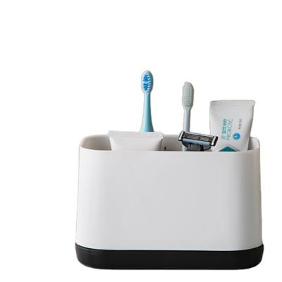 China OEM Viable Logo Toothpaste Dispenser Self Draining Toothbrush Container Plastic Automatic Toothbrush Holder for sale