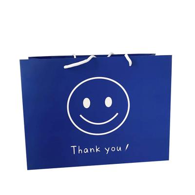 China Recyclable Folding Custom Printing Paper Bag Clothing Packaging Bag Shopping Gift Blue Paper Bag for sale