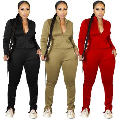 China Solid Logo Solid Tracksuits Women Outfit Breathable Custom Sports Tracksuits Two Piece Set Top And Zipper Slit Pants Set for sale