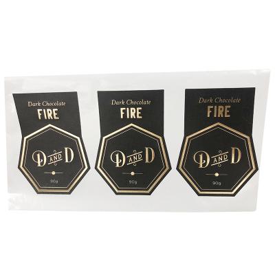 China Customized Hot Stamping Printing Waterproof Waterproof Logo Round Self Adhesive Gold Foil Black Labels Stickers for sale