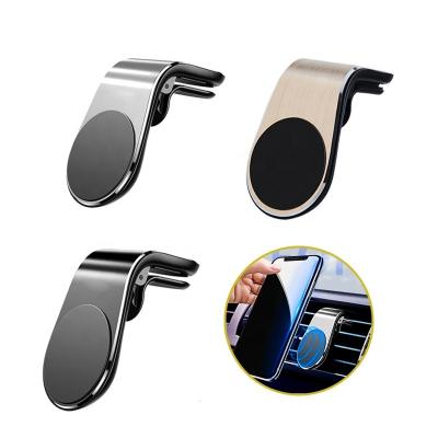 China Reusable Glue And With Strong Magnetic Plate Universal Metal Car Phone Holder 360 Magnet Mobile Phone Stand For Air Vent for sale