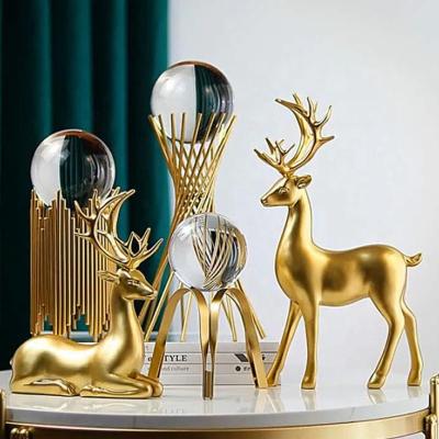 China Luxury Decorative Popular Golden Deer Table Ostrich Flamingo Metal Ornament Morden Factory Crystal Ball Home Decor for sale