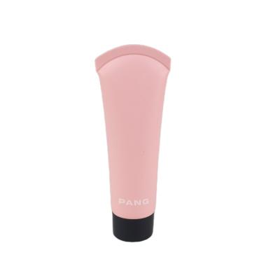 China Cosmetics Matt Pink Candy Cane Tube Cosmetic Packaging With Black Screw Cap for sale