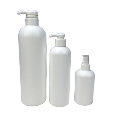 China Cosmetic Packaging 8 16 32 Ounce White Empty 250 500 1000ml Boston Round Lotion HDPE Plastic Pump Bottle for sale