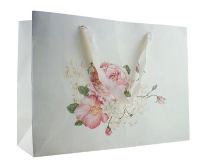 China High Quality Recycled Materials Size Custom Paper Packaging Floral Printing Skin Care Cosmetic Bag for sale