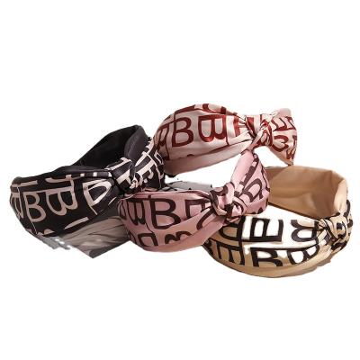 China 4 Colors Luxury Designer Popular Wide Side Non-slip Bandana Hair Band Headband Letter Crossed Print Letter Crossed Hair Accessories for sale