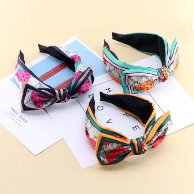 China Popular Designer Bowknot Strawberry Letter Flower Crossed Wide Side Non-slip Bandana Hair Band Women Hair Accessories for sale