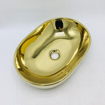 China Modern Shiny Gold Wash Sink Hand Wash Basin And Basin Egg Shape Gold Bathroom Sink for sale