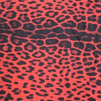 China Custom printed silky stretch satin organic red leopard design silky silk like polygon satin fabric for dresses for sale