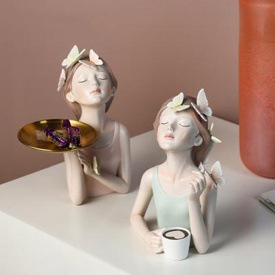 China Europe Decoration Light Luxury Butterfly Creative Home Girl Holding Flowers Living Room Porch Office Crafts Resin Art Decoration for sale