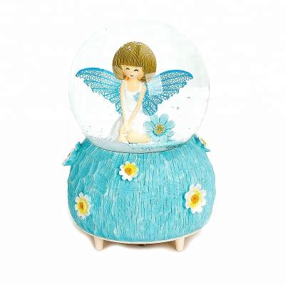 China Europe Angel Girl With Blue Wings 100mm Resin Craft Musical, Music And Snow Ball Spinning Works Snow Globe Gifts For Kids for sale