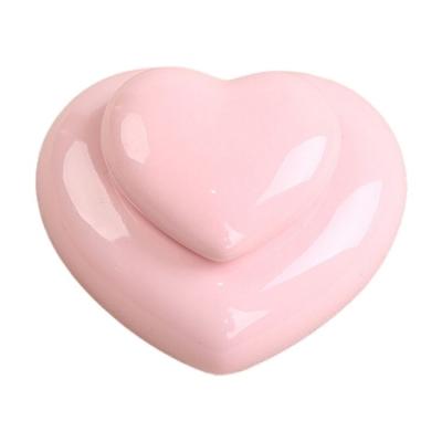 China Pink porcelain viable urns for pets heart shaped keepsake ceramic pet cremains urn for mini urn for sale