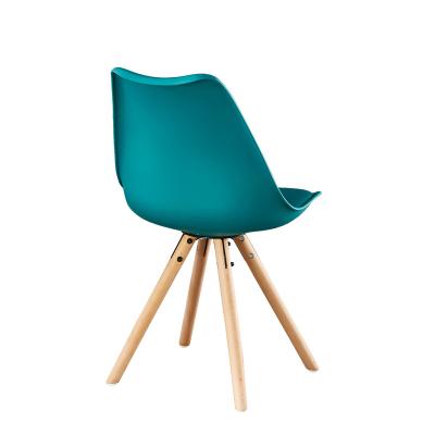 China Simple And Comfortable Cheap Plastic Chair PP Seat And Cushion Wood Legs High Quality Hot Selling Plastic Dining Chair for sale