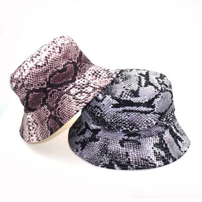 China Barred 2021 low MOQ new design women fashion wide brim faux snakeskin print bucket hat for sale