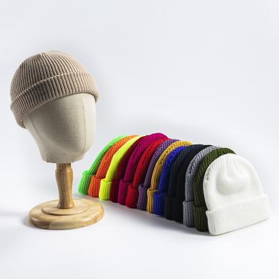 China COMMON Winter High Quality Plain Dyed Beanie Hat Custom Made 100% Acrylic Warm Knitted Beanie Custom Logo for sale