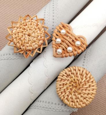 China Retro Rattan Round Heart Napkin Buckle Rectangle Sunflower Heart Bead Handmade Napkin Ring for sale