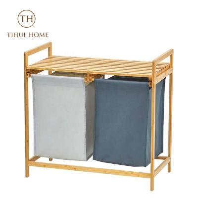 China Tihui Sustainable Home Double 2 Section Bamboo Freestanding Laundry Hamper Organizer With Removable Storage Sorter Bags for sale