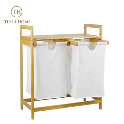 China Tihui Sustainable Home Double 2 Section Bamboo Freestanding Laundry Hamper Organizer With Removable Storage Sorter Bags for sale