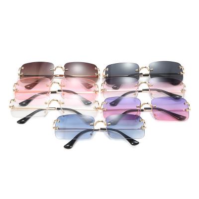 China Rimless Fashion Balancing Sunglasses For Women 2022 Personality Small Frame Trendy Sunglasses INSStyle Glass Street Shot for sale