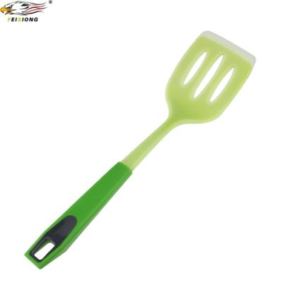 China Sustainable Silicone Kitchen Slotted Turner With PP Handle Cooking Tools for sale