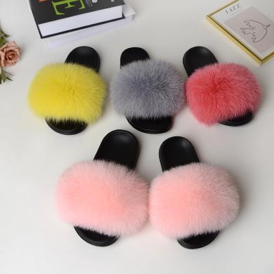 China CUSHIONING 100% Fluffy Colorful Fox Raccoon Fur Slipper Eva Logo Raccoon Fur Slides Custom Indoor Unique Furry Sandal For Women for sale