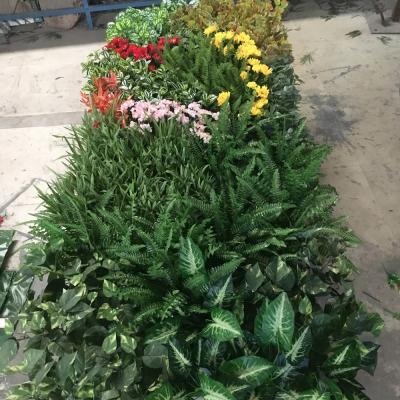 China PE UV Outdoor Artificial Plants Wall Fake Grass Wall For Supermarket for sale