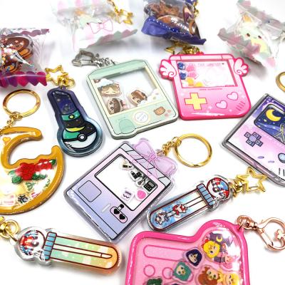 China Promotion Gift Charm Anime Custom Cartoon Flip Acrylic Charm With Epoxy Glitter Shaker Keychains for sale