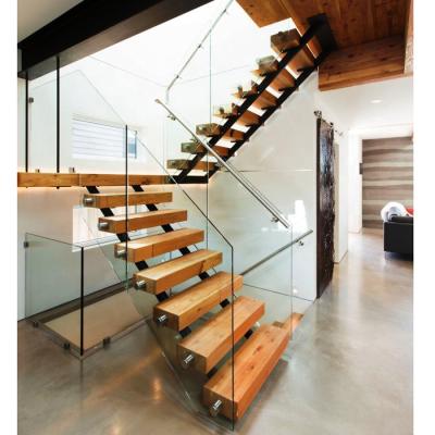 China Modern steel wooden staircase interior design with 80mm thick solid beech treads and tempered glass balustrade for sale