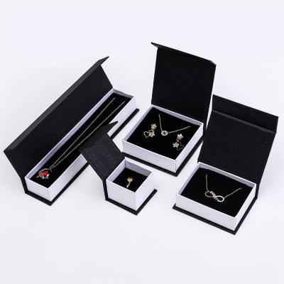 China Recyclable Wholesale Magnetic Clamshell Jewelry Box Book Shape Magnet Jewelry Gift Box Earrings Packing Necklace Ring Box for sale