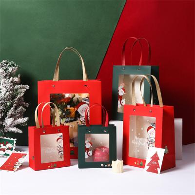 China Recycled Materials Christmas Gift Handbag Window Paper Bag Custom Flowers Packing Exquisite Gift Card Paper Candy Bag for sale