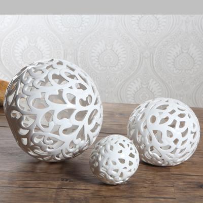 China New Classic/Postmodern Modern Nordic Home Decor Ball Shape Hollowed-out Small Ceramics Gift Craft Table Decoration Centerpieces All Hand Carved for sale