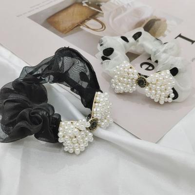 China New pearl ribbon diamond bowknot hair circle soft temperament contracted yarn wave point ball high elastic head elastic band for sale