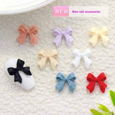 China Nail Art Beauty 50pcs Frosted Bow 3D Nail Art Professional Nail Accessories Wholesale Multicolor Decoration for sale