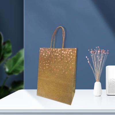 China Recyclable Chic Hot Stamping Gold Kraft Paper Bag Gift Bag Party Supplies Wedding Favors Baby Giftgs for sale