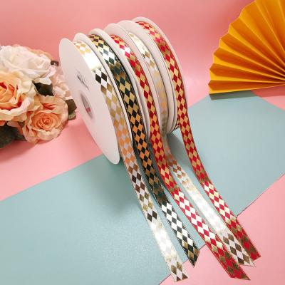 China Manufacturer Wholesale Gift Packaging 15mm Gold Hot Stamping Ribbon Polyester Hot Stamping Gold / Silver Glittering Ribbon for sale