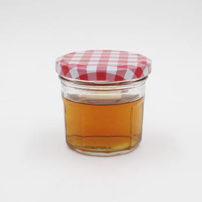 China 250ml canned food glass jam jars for clear glasses, honey jars for sale, caviar package bottles with metal lily for sale