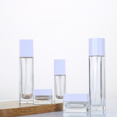 China 30ml 100ml luxury empty clear glass lotion pump bottle with acrylic cover for cosmetic products packaging for sale