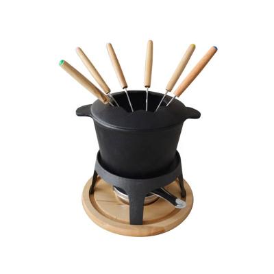 China Sustainable cast iron fondue set with wooden base, with forks for sale