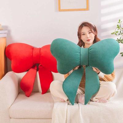 China Simple wholesale red plush toy pillow bow accessories sofa creative home doll for sale