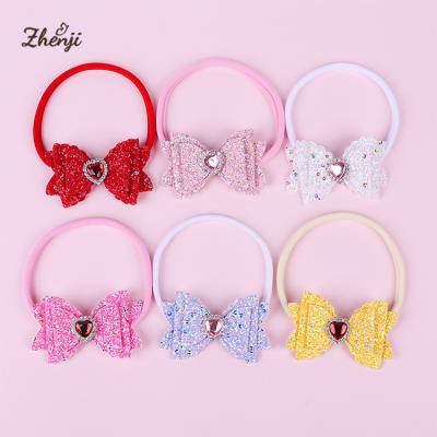 China Sweet Children's Bow Headband Valentine's Day Baby Nylon Sequins Love Faux Stone Solid Color Stretch Hair Band for sale