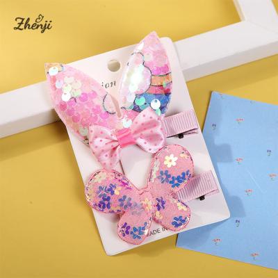 China 2022 New Children's Easter Candy Cute Bunny Ears Pink Duckbill Hair Clip Bowknot Sequin Hairpin for sale